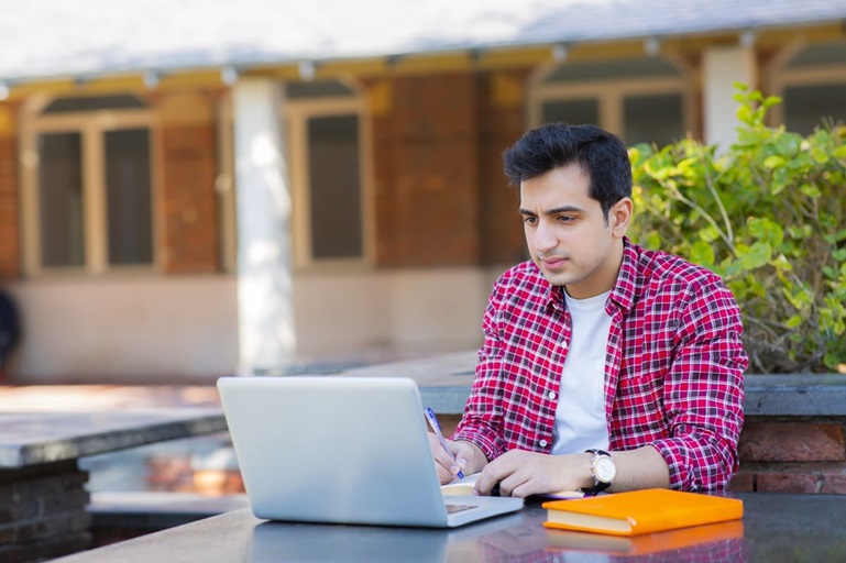student learning about the new post-graduation work permit requirements