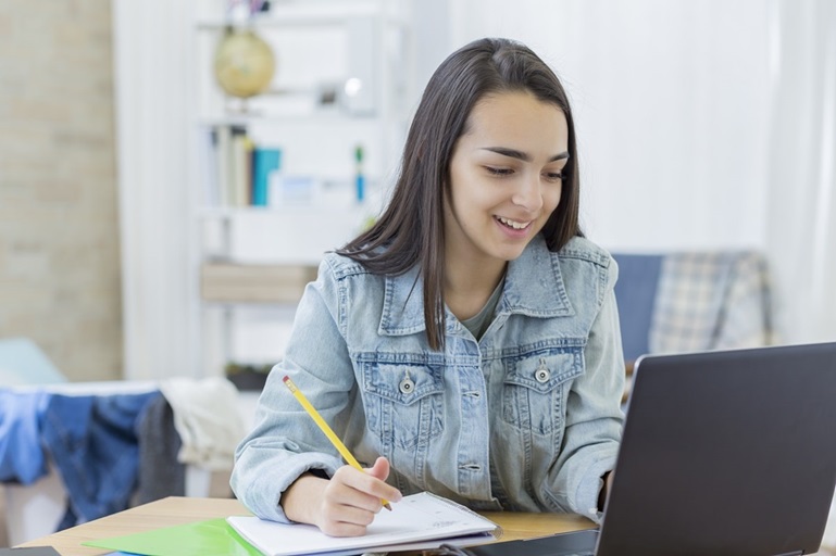 Woman studying English to meet the requirement for Canada work permit under the new post-graduation work permit rules